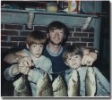 The author with sons Eric and Gregg iin 1970 with great string of bass. We don't catch as many big ones now that there are over 85 bass tournaments per summer on Lake Winni.