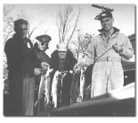Bill Martel (left) with Army buddies, catching salmon and trout.