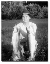 Ted St. Onge's son, Scott with a big whitefish and a big salmon.