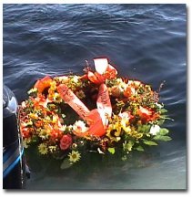 Wreath in Paul Phillippe's memory floating over his favorite fishing spot on Lake Winni.