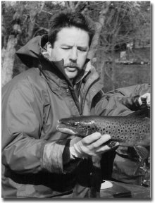 Master Angler Steve Perry with large male salmon in fall.