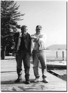 Steve and friend with nice catch of Lakers, salmon and rainbow trout.