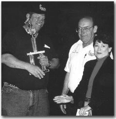 Mr. & Mrs. Rick Davis awarding the Grand Prize trophy to the 2000 Derby winner.