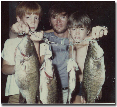 Sons, Eric & Gregg with father with very large bass!1969.