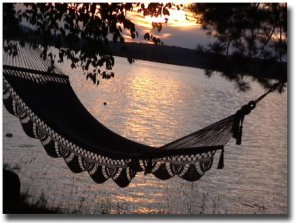Early morning sunrise though an angler's mid day resting place -- his hammock.