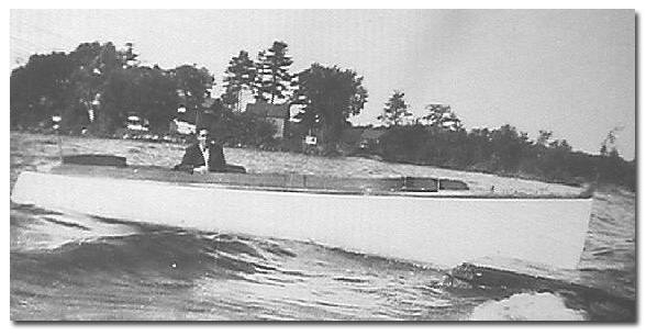 Bill Martel guiding father's old Johnson Laker boat after WWII.