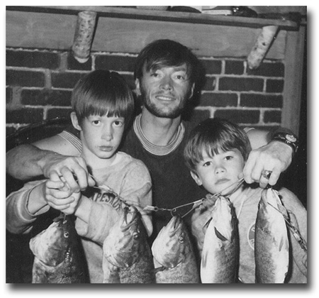 Eric and Gregg lyon in 1970, with father and string of bass.