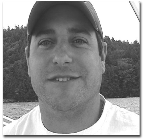 Jason Parent smiling while angling in the smile of the Great Spirit.