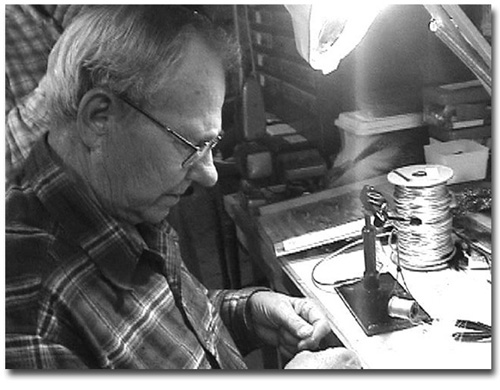 Jim Warner doing the work he loves, tying flies.