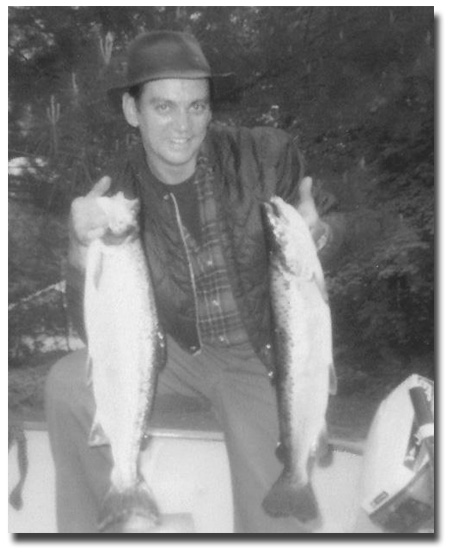 Fishing in Alton Bay on a gray day, Ted St. Onge caught these two beauties.