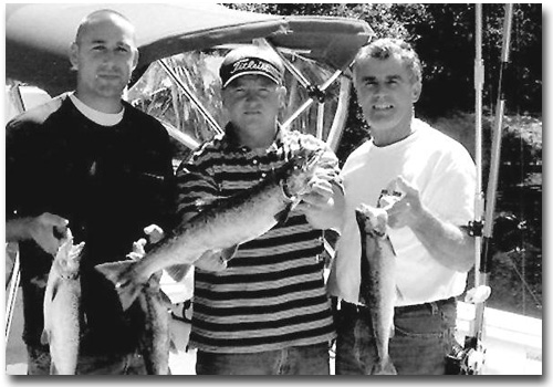 Travis Williams and two friends with a nice catch of salmon from "Cool Waters."